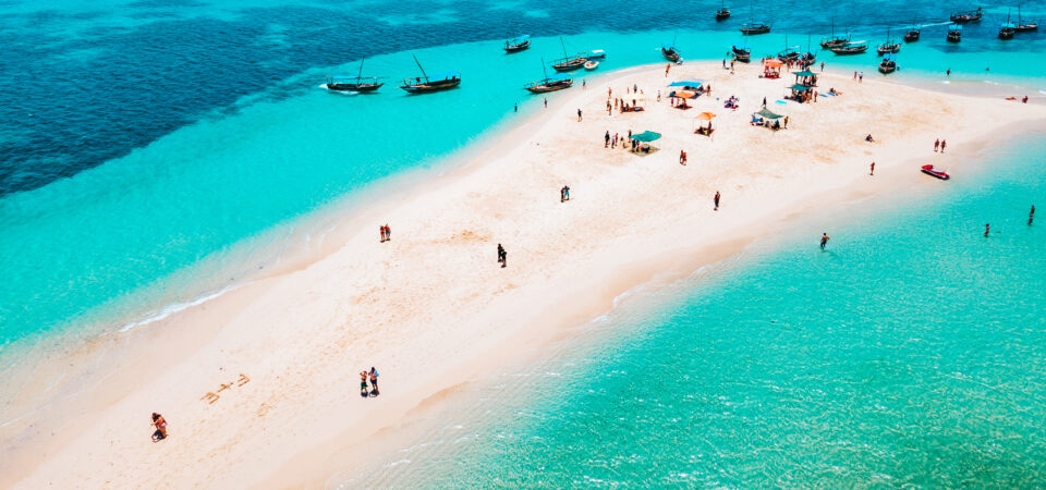 Aerial view of a sandbank surrounded by turquoise Indian Ocean waters near Zanzibar
