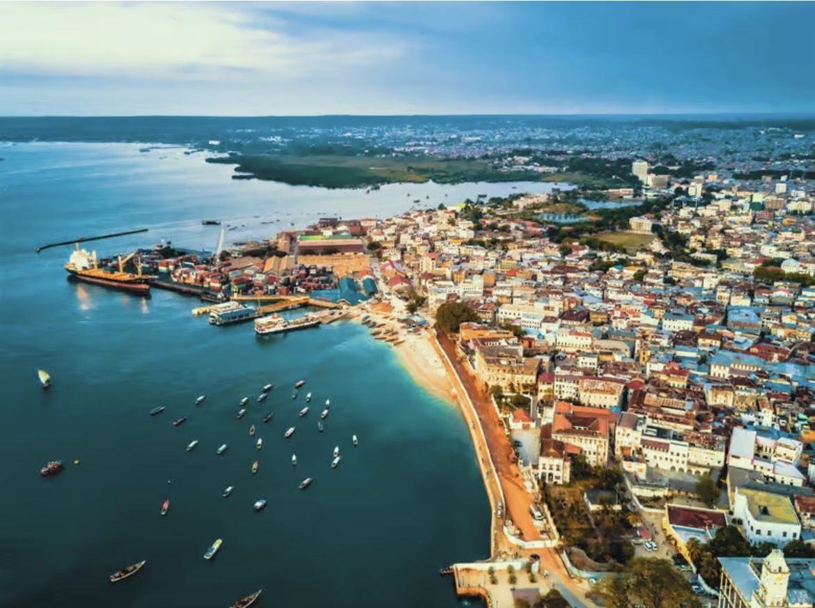 Aerial view of Stone Town, Zanzibar, its seafront and harbour dotted with boats